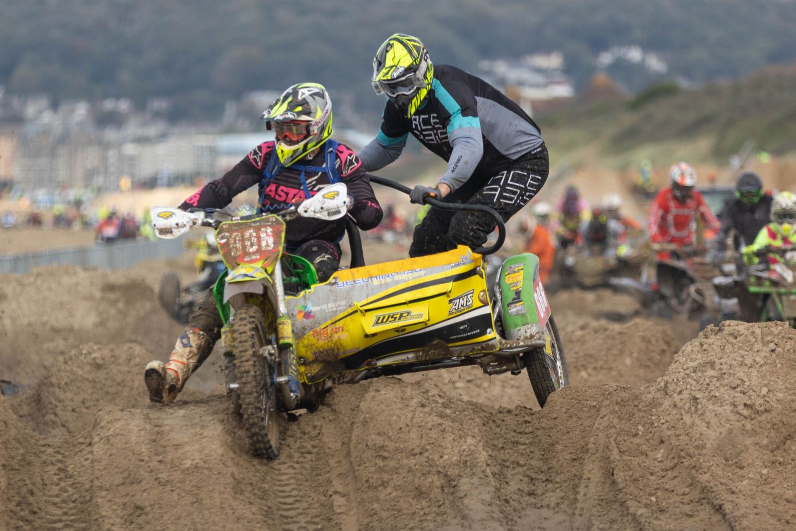 A yellow motorbike and sidecar at the Weston-super-Mare Beach Race